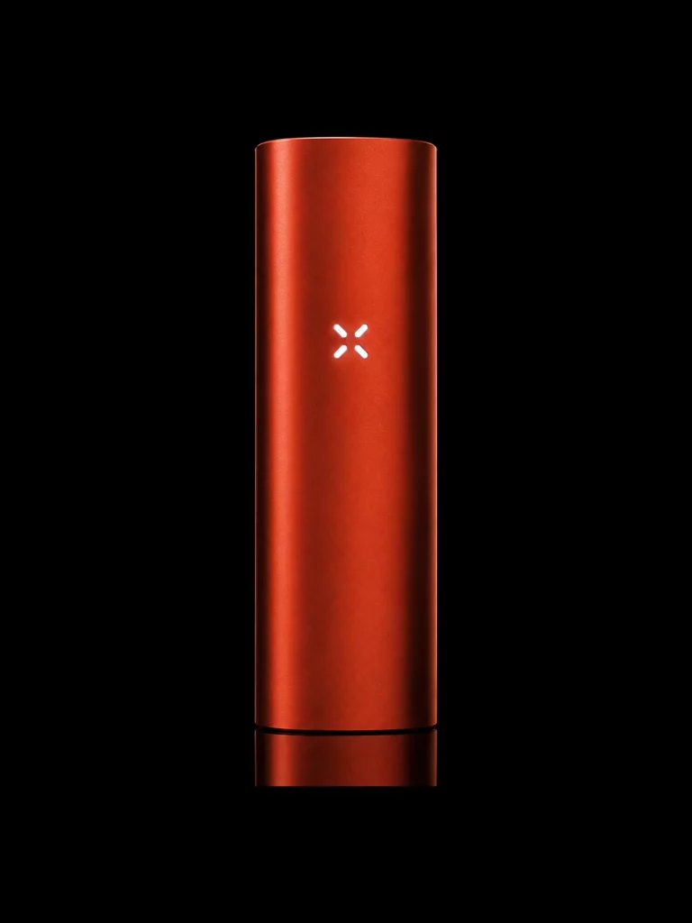 Vaporisateur PAX Mini coloris orange avec LED en pétales - fond noir studio, boutique Nature Lab